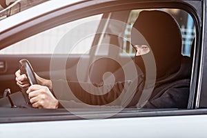 Auto thief driving a stolen car photo