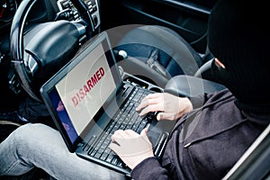 Auto thief trying to break car security systems