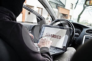 Auto thief trying to break car security systems