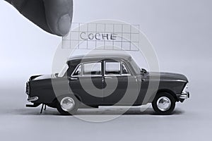 Auto word written on a piece of paper, Coche in Spanish