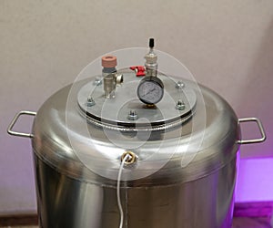 Autoclave made of stainless steel for sterilization. Industrial food production, food safety