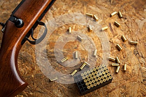 Automat and rifle with cartridges and shells, shooting on the street