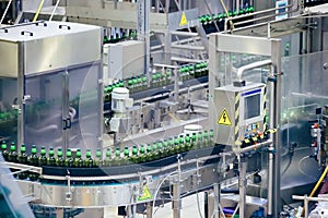 Automated beer bottling production line. Packed beer bottles on conveyor belt