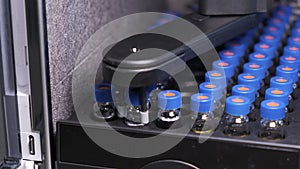 Automated conveyor line of chromatographic robotic device. Process of work with medical samples in tubes. Testing of