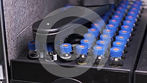 Automated conveyor line of chromatographic robotic device. Process of work with medical samples in tubes. Testing of