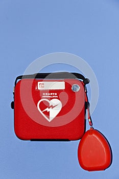 Automated External Defibrillator on Blue Wall