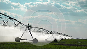Automated Farming Irrigation Sprinklers System in Operation on Cultivated Agricultural Field