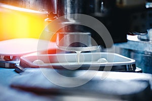 Automated filling of yoghurt into packages. Food production, dairy plant