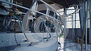 Automated milking carousel system at livestock farm. Empty dairy production