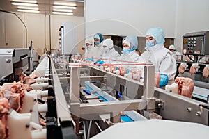 Automated production line with packaging and cutting of meat in modern food factory.Meat processing equipment. Food