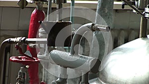 Automated production of medicines. Worker turns the valve in the pipe