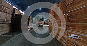 Automated production of plywood sheets at the factory. Finished veneer sheets. Plywood production.