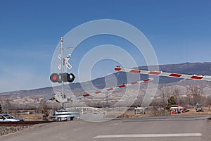 Automated protected railroad crossing with crossbucks and lights