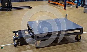 AGV carry cardboard in modern warehouse photo