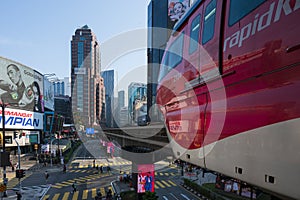 Automated red aerial monorail train at Bukit Bintang district of Kuala Lumpur