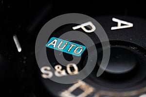 The automatic adjustment dial is close on the camera. Old and dirty