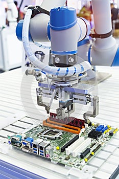 automatic arm installing a computer chip with ram