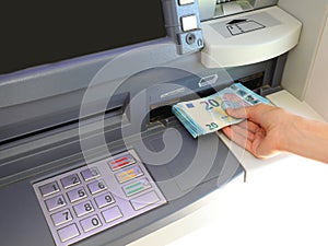 automatic ATM to withdraw money in European 20 Euro banknotes in