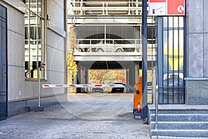 Automatic barrier gate at the entrance to multi-storey car park. Closed barrier of car parking