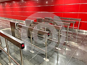 Automatic barriers for control people entered in railway station or in metro, red light show for no entrance, necessary tickets,