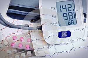 Automatic blood pressure meter and pills in blister packs