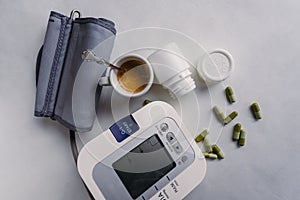 Automatic blood pressure meter with pills and coffee