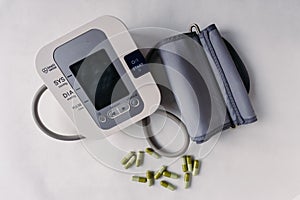 Automatic blood pressure meter and pills. High blood pressure concept