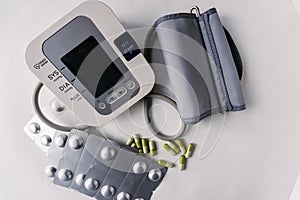 Automatic blood pressure meter and pills. High blood pressure concept