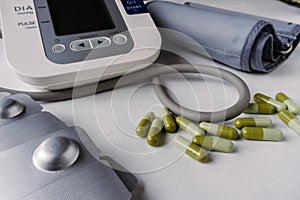 Automatic blood pressure meter and pills. High blood pressure concept