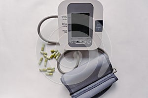 Automatic blood pressure meter and pills. High blood pressure concept