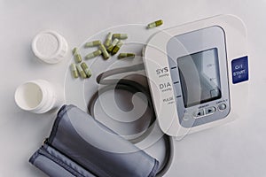 Automatic blood pressure meter and pills. High blood pressure concept