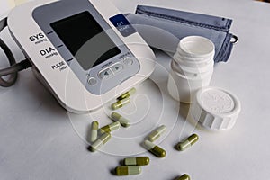 Automatic blood pressure meter and pills. High blood pressure concept
