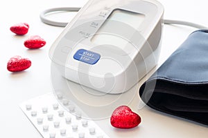Automatic blood pressure meter on a white background
