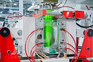 Automatic blow molding machine: manufacturing of empty green plastic jerrycans