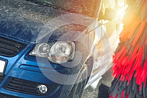 Automatic car wash in action. Car wash concept. Automated technology