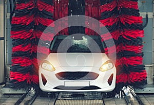 Automatic car wash in action. Car wash concept. Automated technology photo