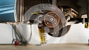 Automatic change of brake fluid in a car service.