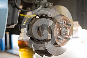 Automatic change of brake fluid in a car service.