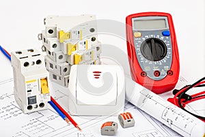 Automatic circuit breakers, digital multimeter. Electrical equipment, protection and control, white background