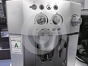 Automatic coffee machines at exhibition on white kitchen background