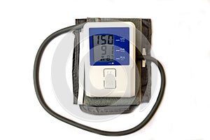 Automatic digital blood pressure monitoring meter on white background.