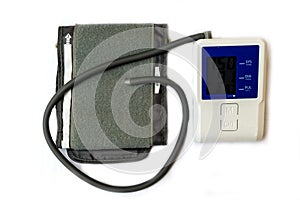 Automatic digital blood pressure monitoring meter on white background.