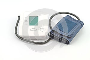 Automatic digital blood pressure monitoring meter on white background