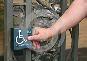 Automatic Door Button Being Pushed by a Gentleman