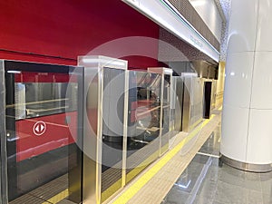 Automatic door platform system at a new modern metro station. Metro security system glass beautiful doors open synchronously with