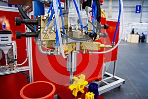 Automatic dosing, mixing and pouring unit for hot curing three-component polyurethane elastomers