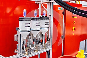 Automatic dosing, mixing and pouring unit for hot curing three-component polyurethane elastomers