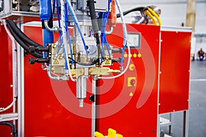 Automatic dosing, mixing and pouring unit for hot curing three-component polyurethane elastomers
