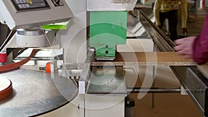 Automatic edge banding machine at a furniture factory