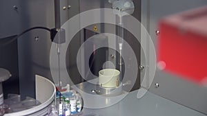 Automatic equipment in pharmaceutical laboratory, vials with medicaments